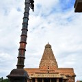 DSC_0298 – Copper made flag post and Enormous Brihadeeswara temple – View from Nandi hall.